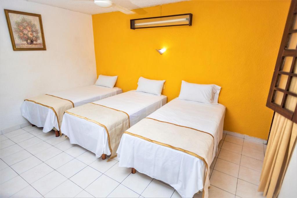Postel nebo postele na pokoji v ubytování Hotel Santa Lucía