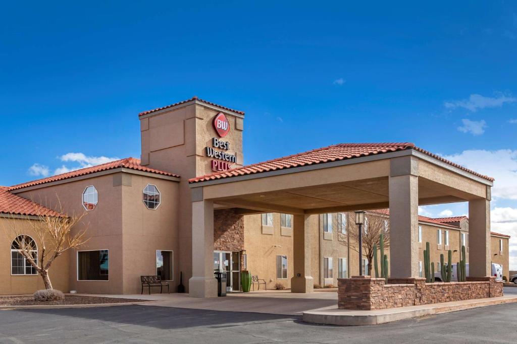 a building with a clock tower on top of it at Best Western Plus Winslow Inn in Winslow