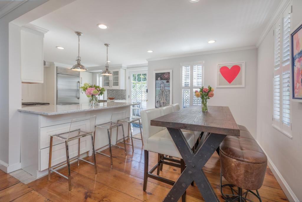 a kitchen and dining room with a wooden table at 45A Pleasant St in Nantucket