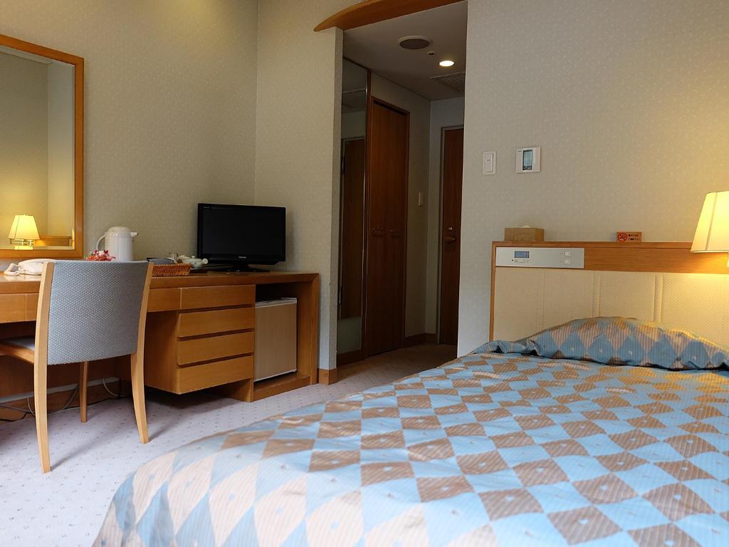 Postel nebo postele na pokoji v ubytování Arima Onsen Gekkoen Korokan