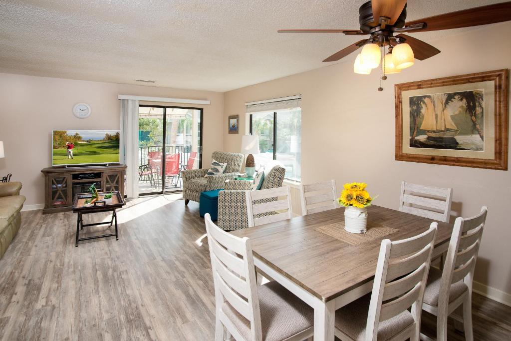 a dining room and living room with a table and chairs at Springwood Villas II in Hilton Head Island