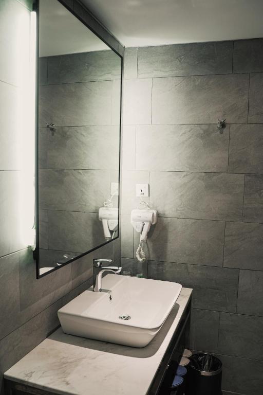Koupelna v ubytování Amigo Hotel