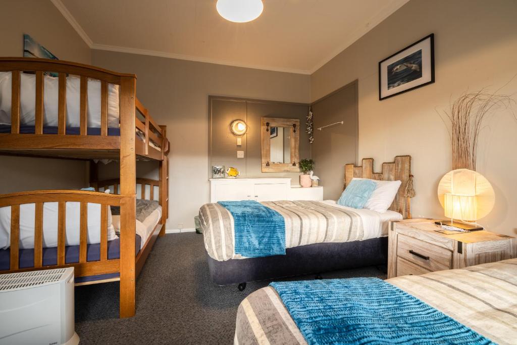 Postel nebo postele na pokoji v ubytování Oamaru Backpackers