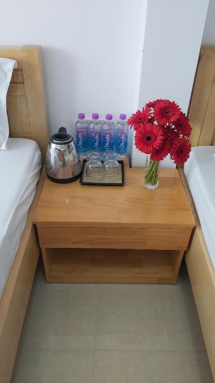 Postel nebo postele na pokoji v ubytování Daisy Dalat House