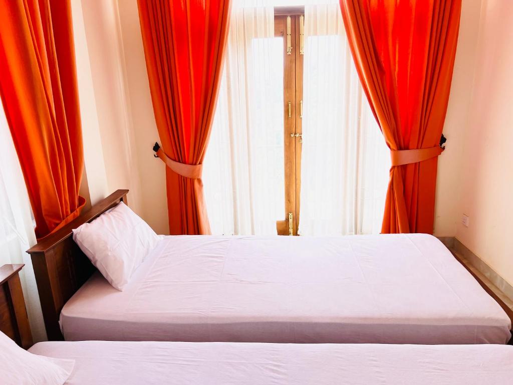 Postel nebo postele na pokoji v ubytování Hansons Homestay