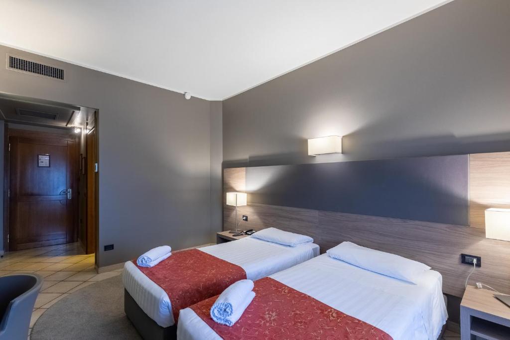Postel nebo postele na pokoji v ubytování Hotel Sunflower