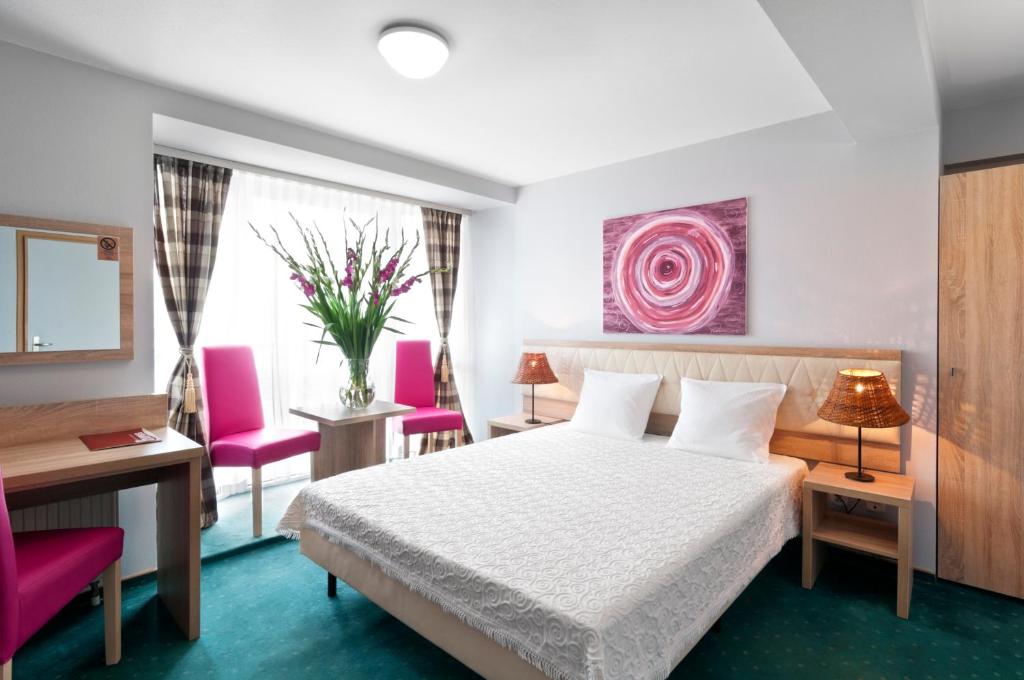 Posteľ alebo postele v izbe v ubytovaní Hotel Petrus