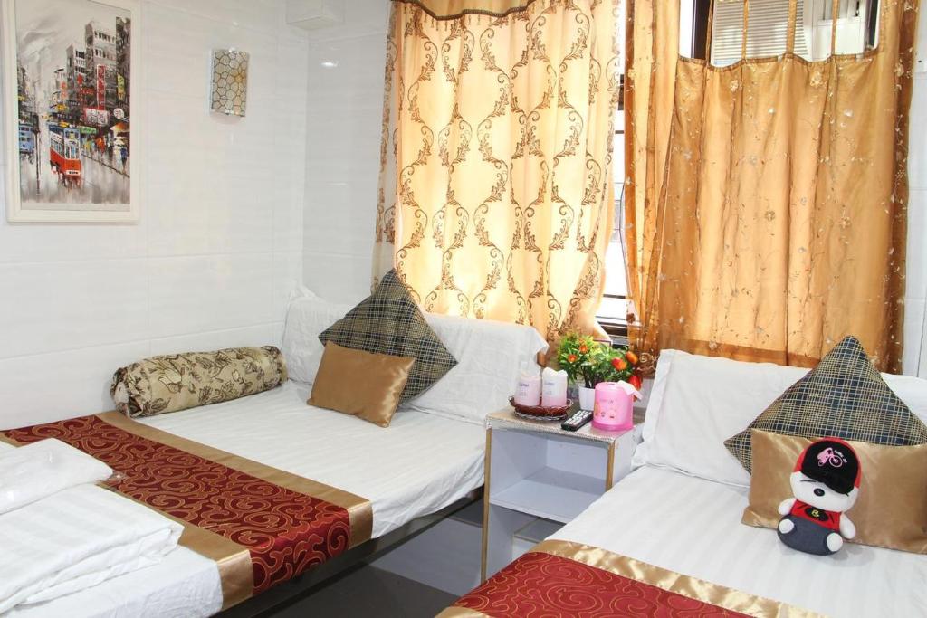 Postel nebo postele na pokoji v ubytování SHANGRI-LA GUEST HOUSE