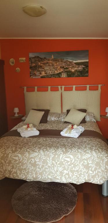 Postel nebo postele na pokoji v ubytování Sassi's Loft