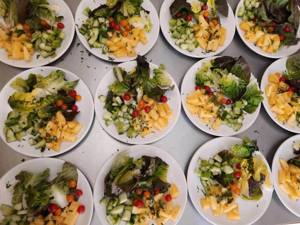 a bunch of plates filled with different types of vegetables at Le Clos des Chênes in Lagarde-Paréol