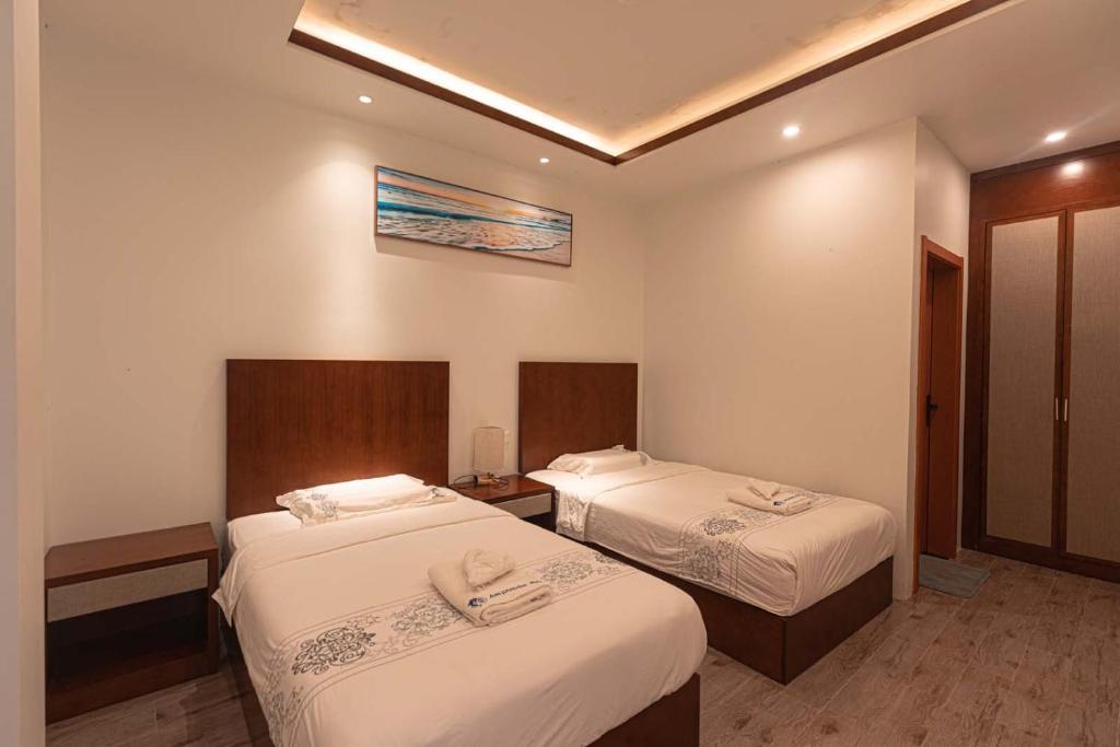Postel nebo postele na pokoji v ubytování Amphitrite Resort