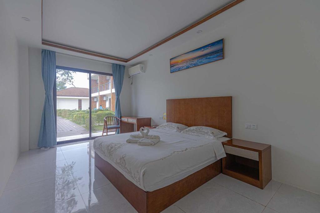 Postel nebo postele na pokoji v ubytování Amphitrite Resort