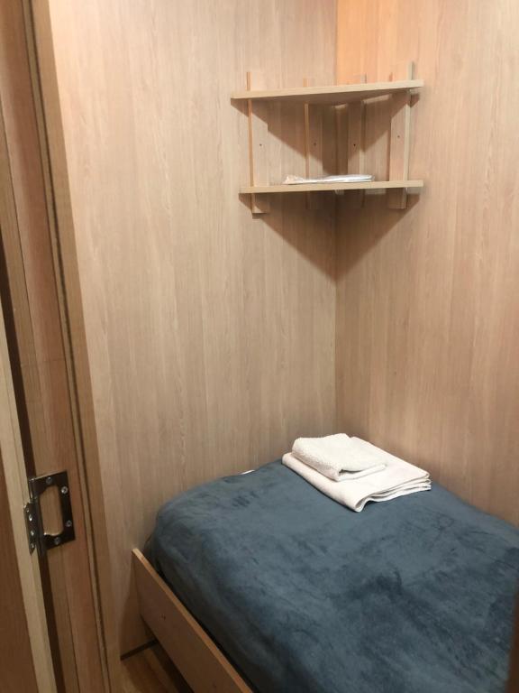 Postel nebo postele na pokoji v ubytování CapsulePlus
