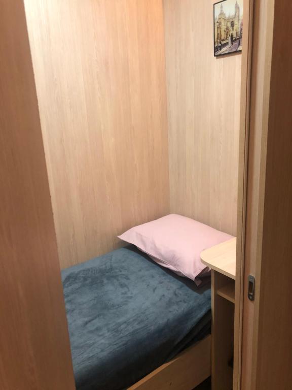 Postel nebo postele na pokoji v ubytování CapsulePlus