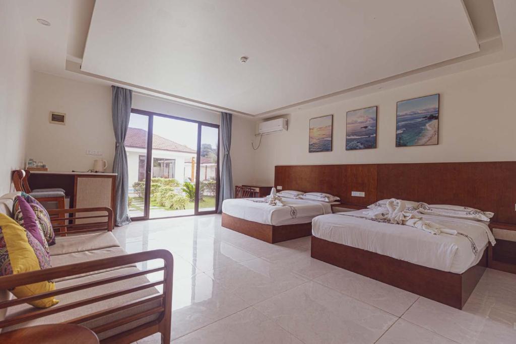 Postel nebo postele na pokoji v ubytování Amphitrite Resort