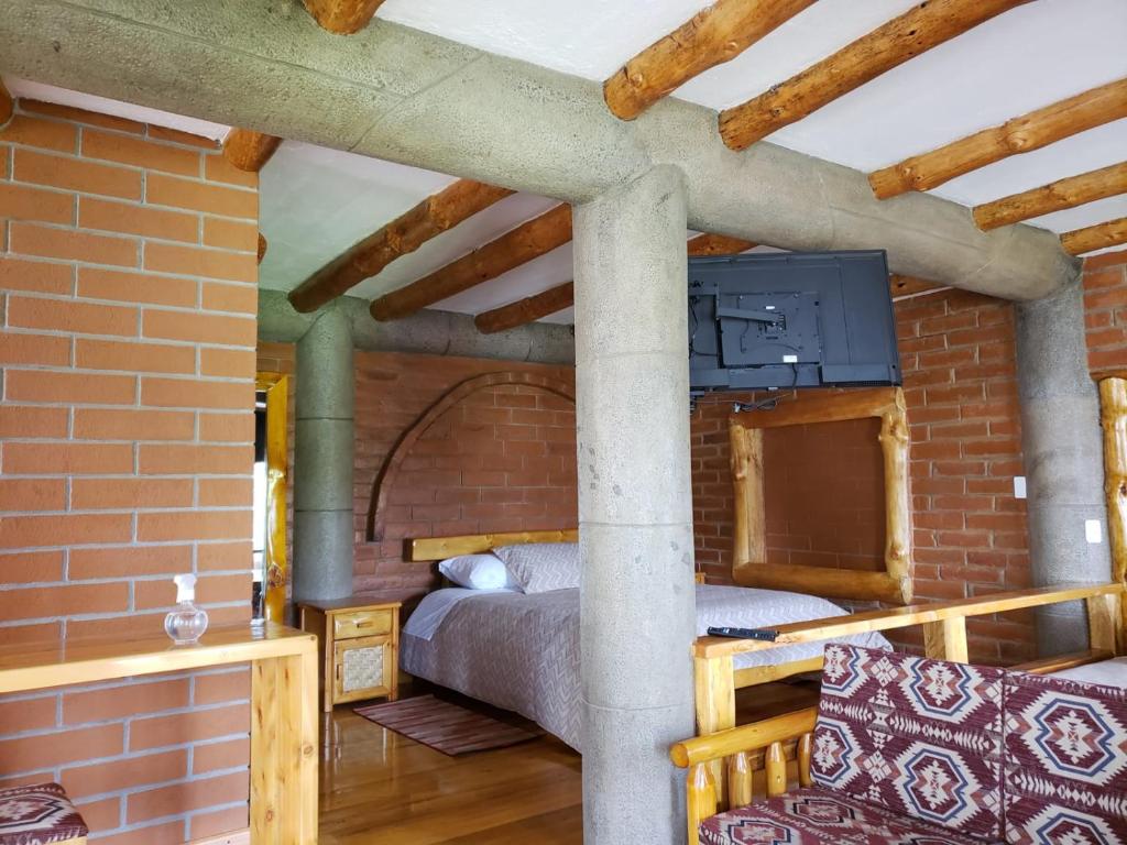 Postel nebo postele na pokoji v ubytování ATALLARO Hospedaje
