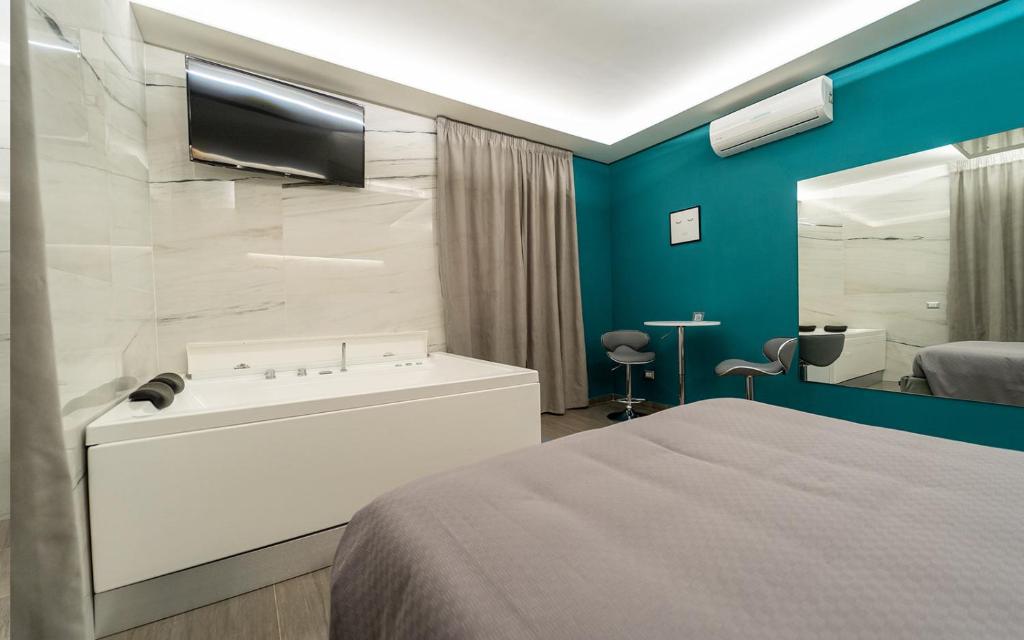 Postel nebo postele na pokoji v ubytování Intimity Luxury Rooms
