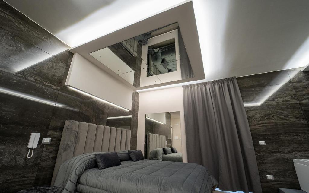 Postel nebo postele na pokoji v ubytování Intimity Luxury Rooms