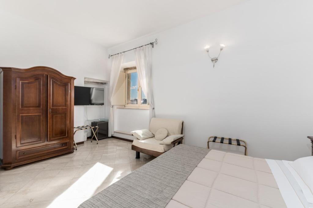 Postel nebo postele na pokoji v ubytování Hotel La Terra