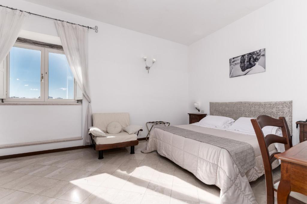 Postel nebo postele na pokoji v ubytování Hotel La Terra