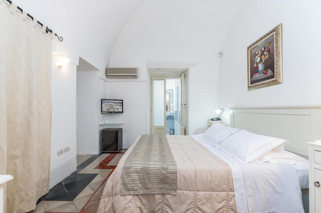 Postel nebo postele na pokoji v ubytování Hotel La Terra