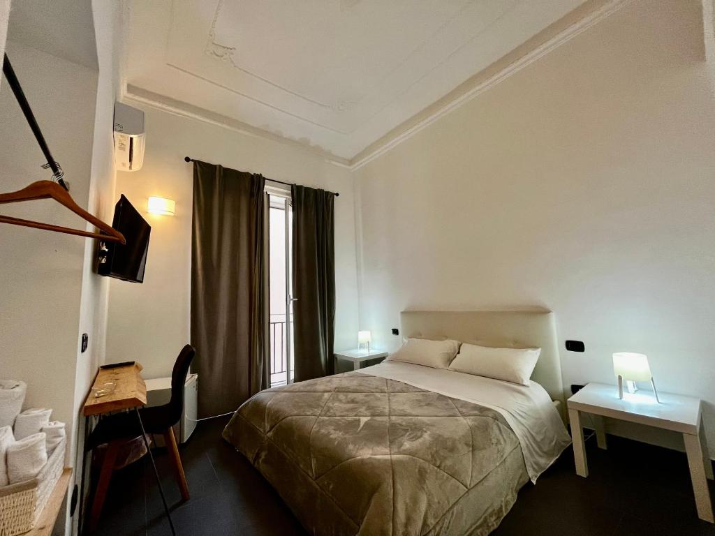 Posteľ alebo postele v izbe v ubytovaní Pupi 93 Rooms