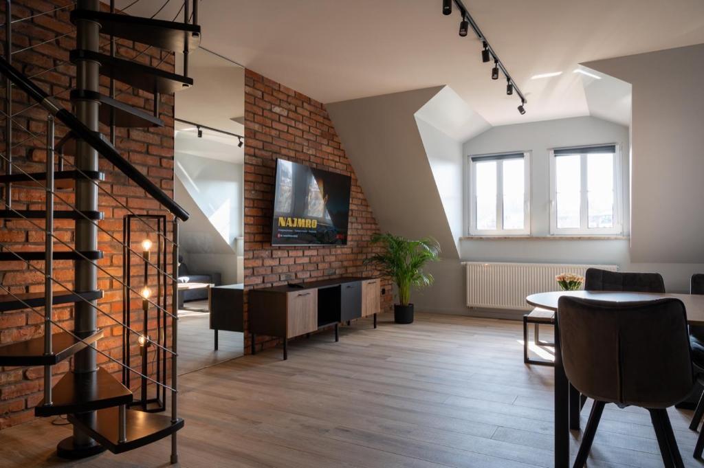 Televízia a/alebo spoločenská miestnosť v ubytovaní BanApart Exclusive Apartments