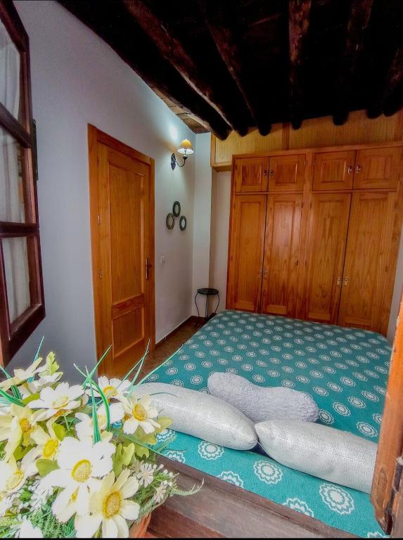 Postel nebo postele na pokoji v ubytování Apartamento Las Flores, disfruta en el Centro de Ronda