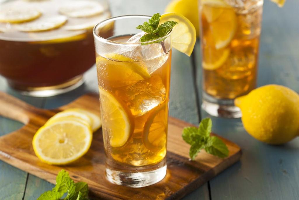 a glass of lemonade with lemon slices and mint at My Studio Hotel Juanda Airport Surabaya in Sedati