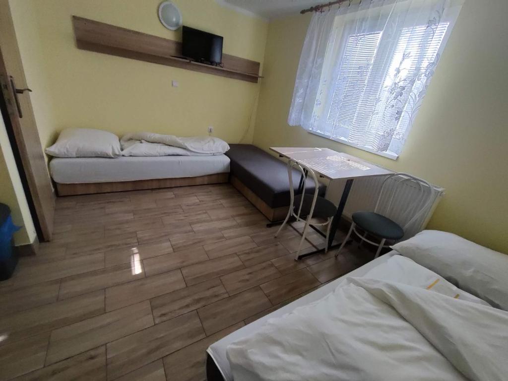 A bed or beds in a room at Rekreačné zariadenie Javorinka