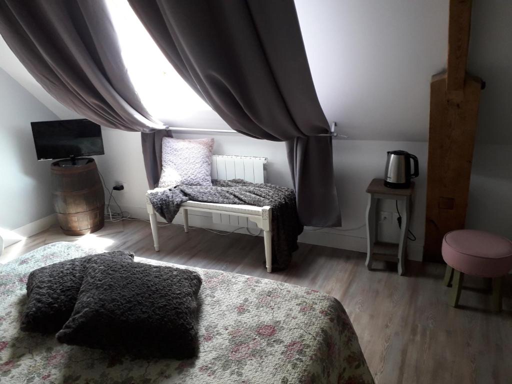 Postel nebo postele na pokoji v ubytování Ferme du Rupalley