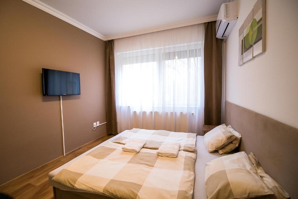 Posteľ alebo postele v izbe v ubytovaní Thermal Next II Weninger Apartman Kiskunhalas