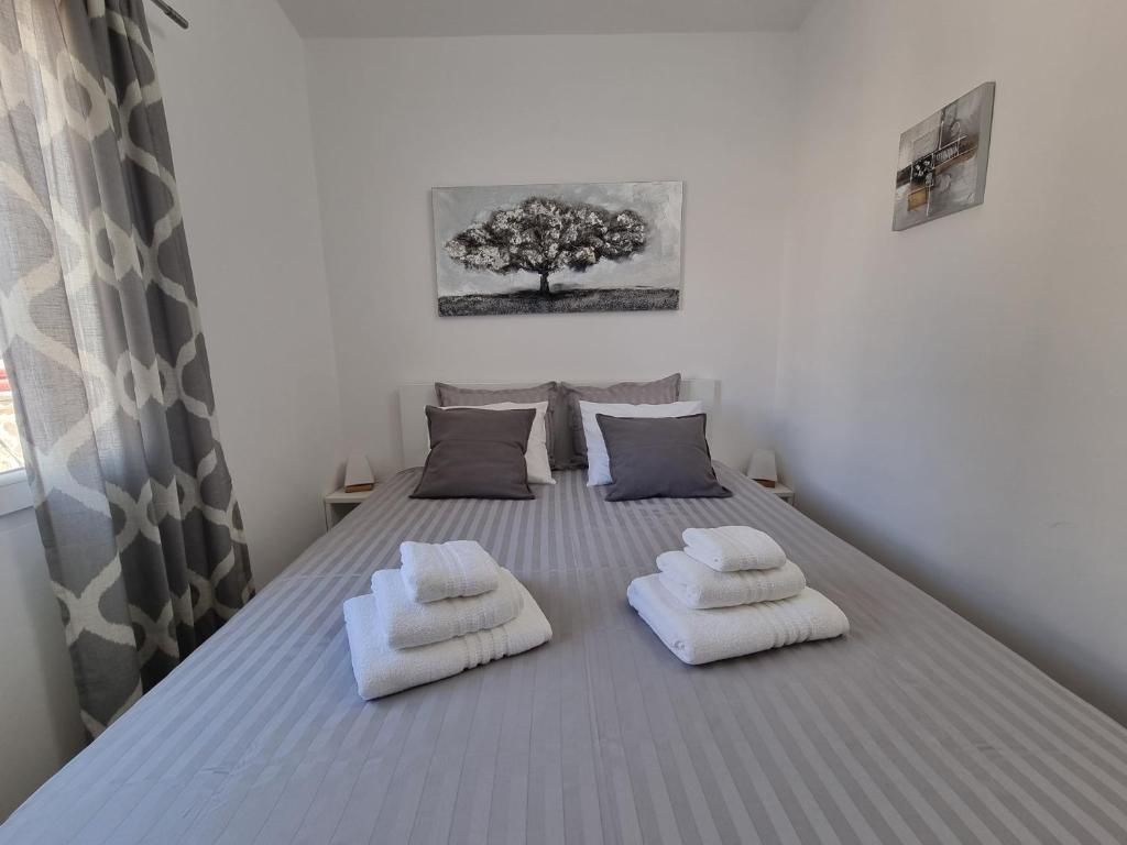 Postel nebo postele na pokoji v ubytování Holiday House Nataly