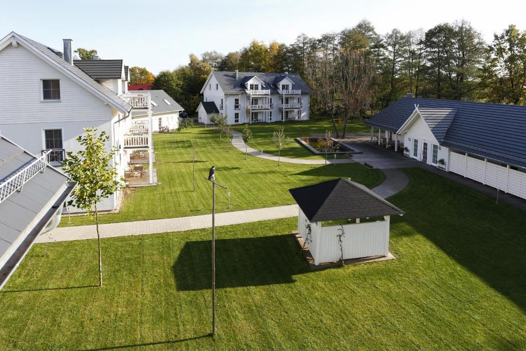 an aerial view of a yard with houses at Louisenhof Ferienapartments und Wellness in Burg