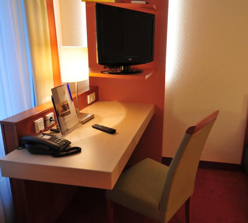 TV a/nebo společenská místnost v ubytování Hotel Flandrischer Hof