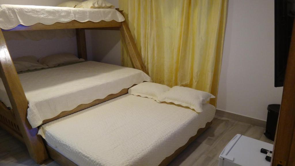 Postel nebo postele na pokoji v ubytování Aparta Suite Villa Roko