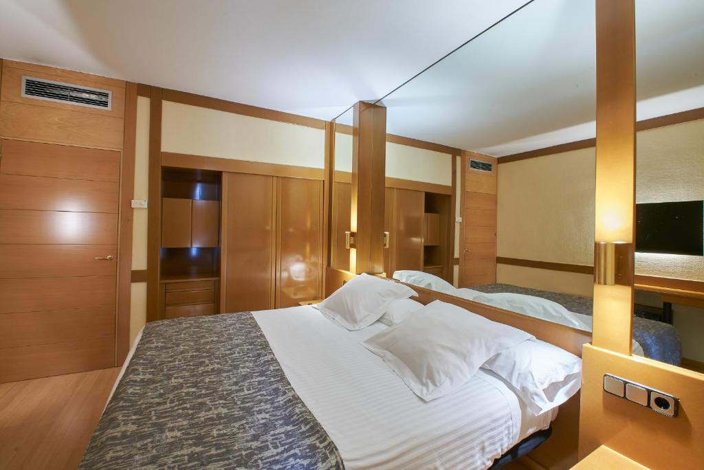 Postel nebo postele na pokoji v ubytování Los Arcos