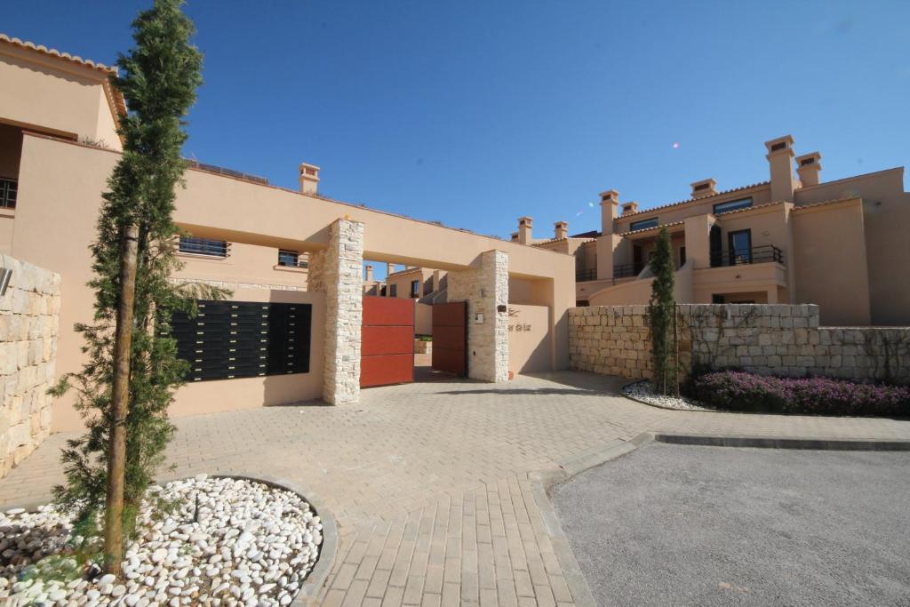 a house with a driveway in front of it at Mar da Luz, Algarve in Luz