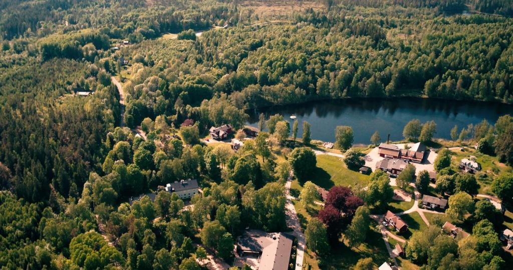 an aerial view of a house and a lake at Kroppefjäll B&B in Dals Rostock