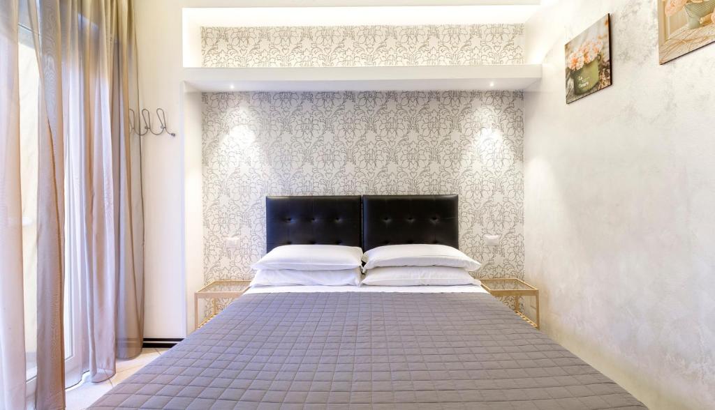 Postel nebo postele na pokoji v ubytování Hotel La Nidiola