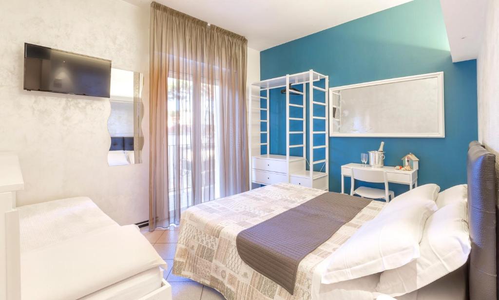 Postel nebo postele na pokoji v ubytování Hotel La Nidiola