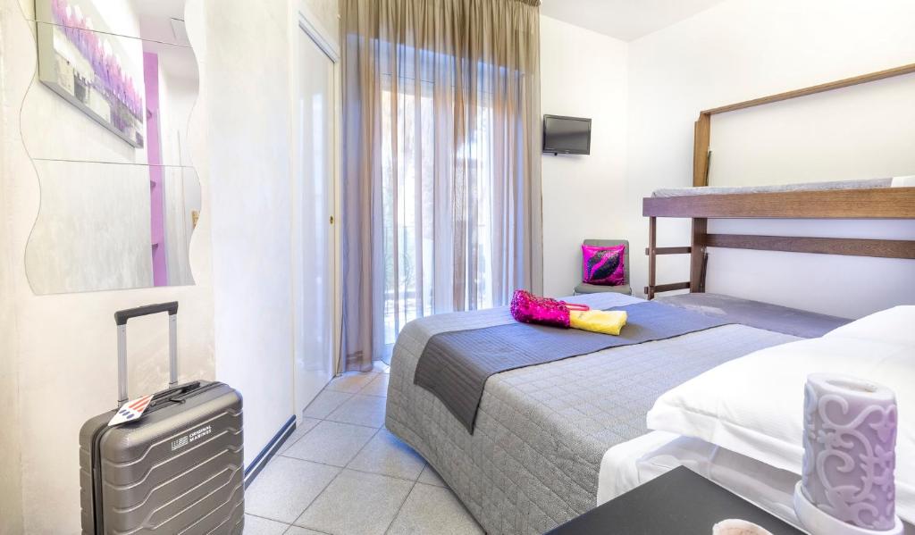 Postel nebo postele na pokoji v ubytování Hotel La Nidiola
