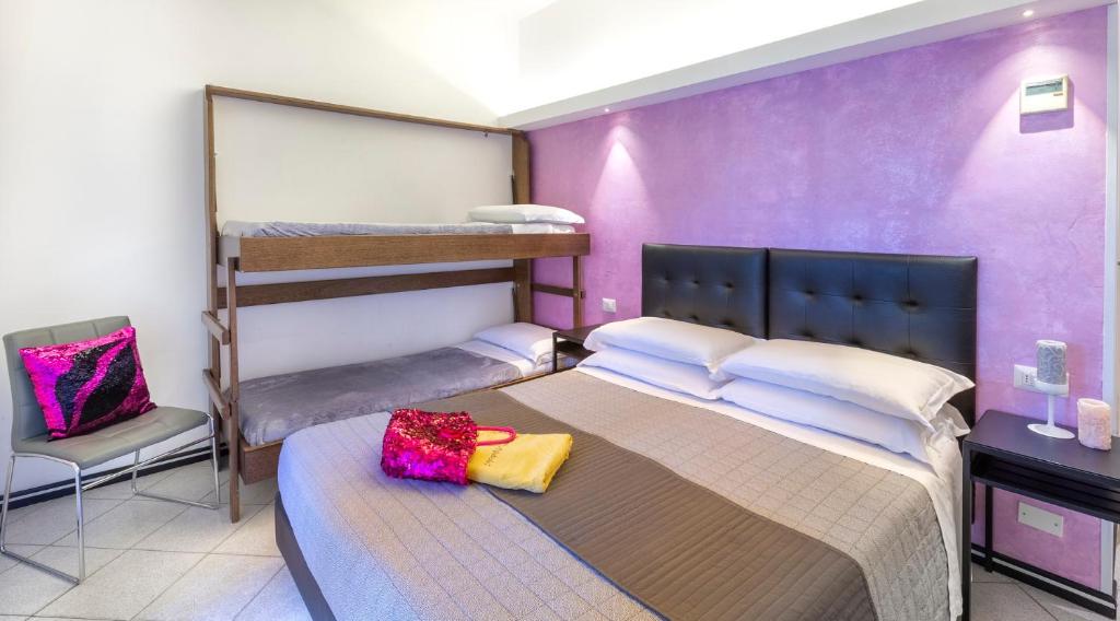 Postel nebo postele na pokoji v ubytování Hotel La Nidiola