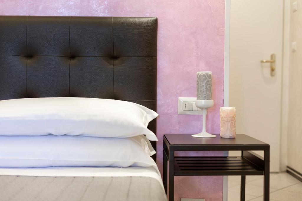 Postel nebo postele na pokoji v ubytování Hotel La Nidiola