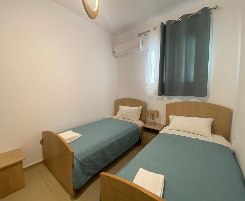 A bed or beds in a room at Elkysti Crete