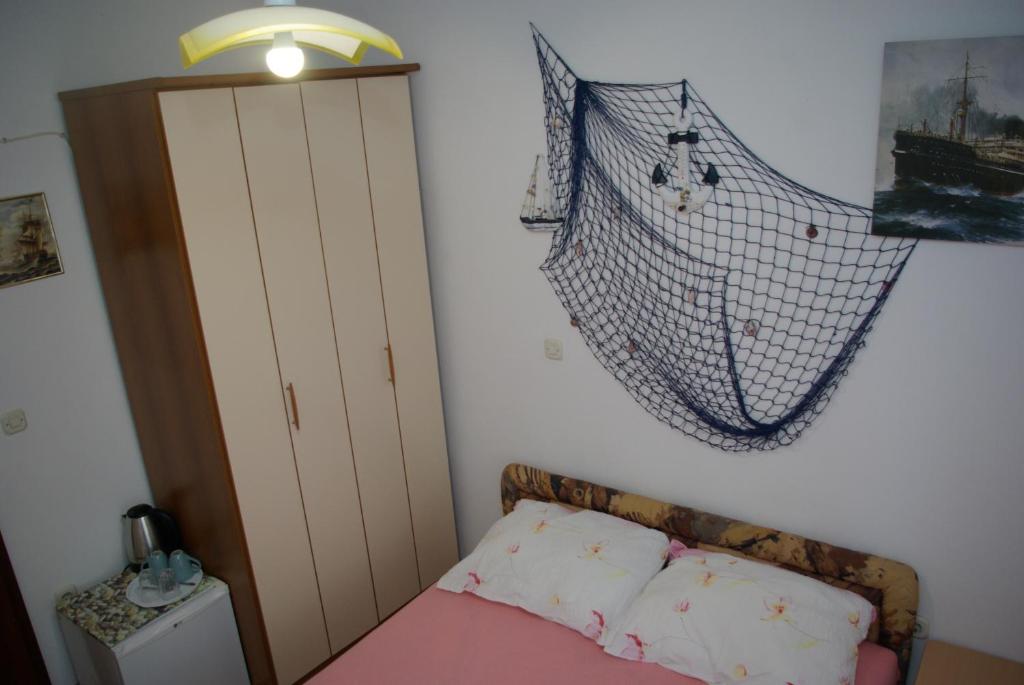 Postel nebo postele na pokoji v ubytování Rooms Tia