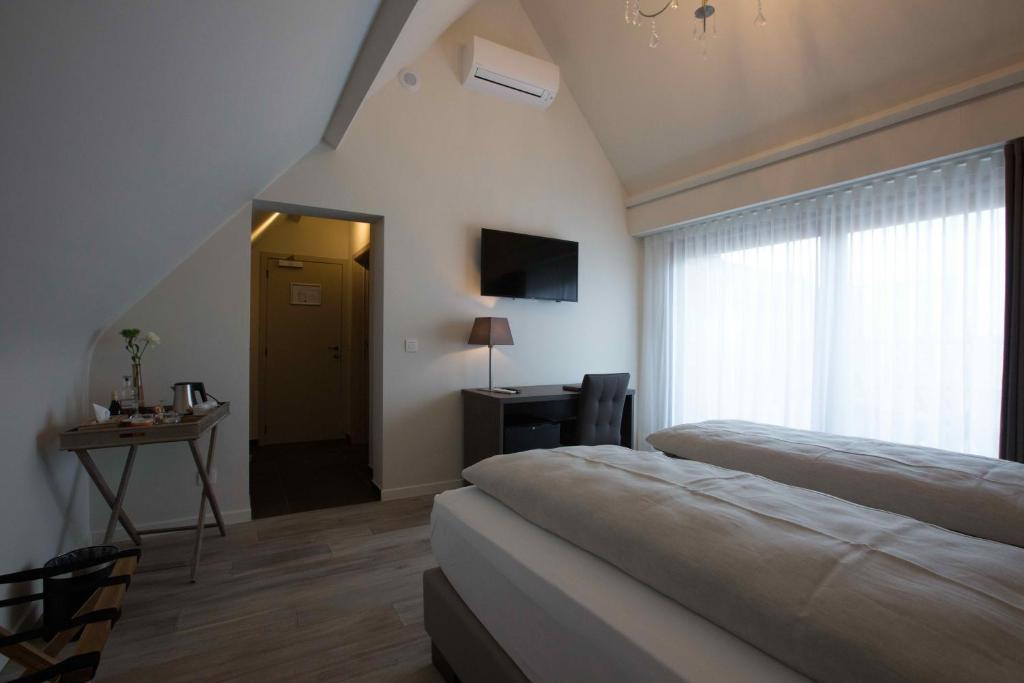 Postel nebo postele na pokoji v ubytování B&B 't Meesterhof