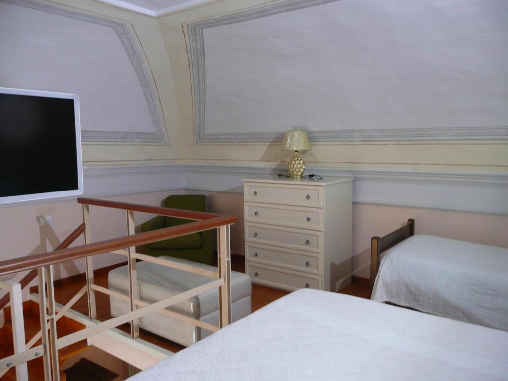 Postel nebo postele na pokoji v ubytování I Papiri B&B Aparthotel