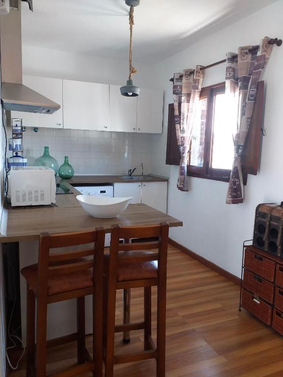 A kitchen or kitchenette at Las Casitas Masdache