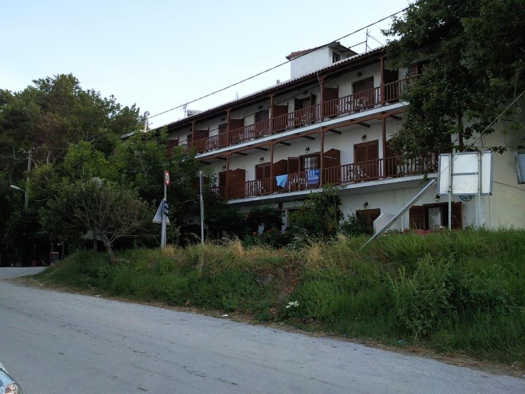 a building with balconies on the side of a road at Katerina in Chorefto